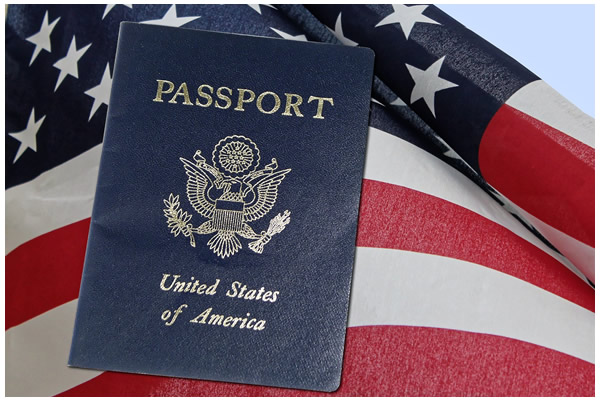 Photo of a U.S. passport on an American flag.